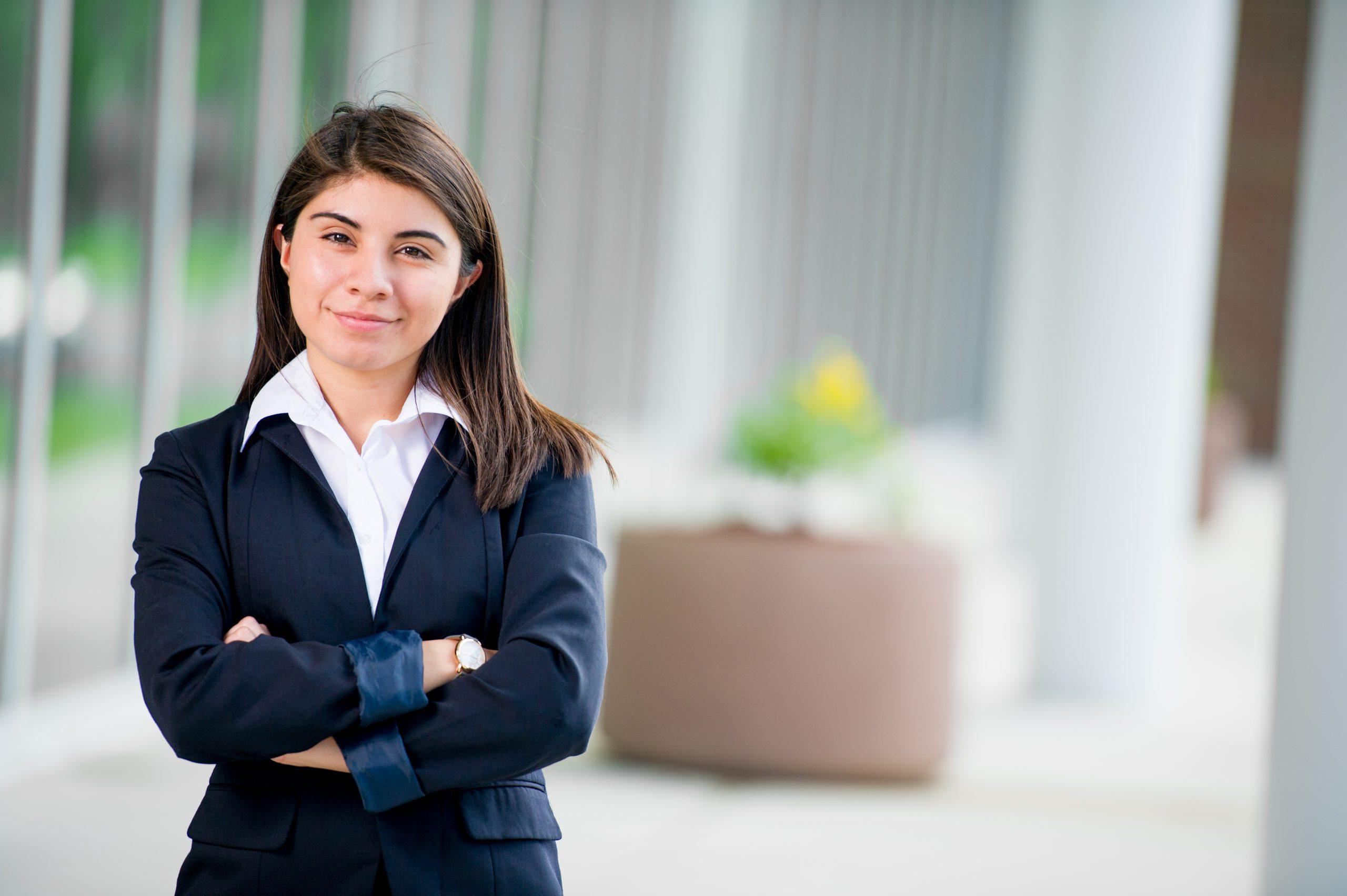 A female in a business suit posing.